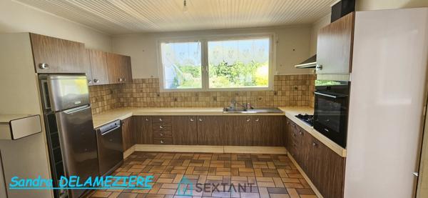 Maison familiale avec garage et jardin