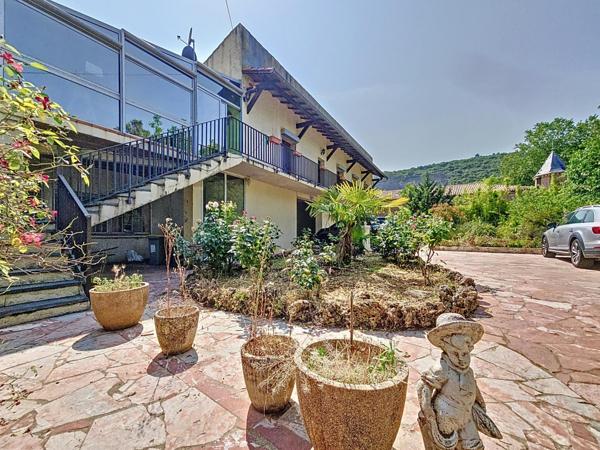 Maison traditionnelle R+1 avec jardin et grand garage – Bédarieux, secteur recherché