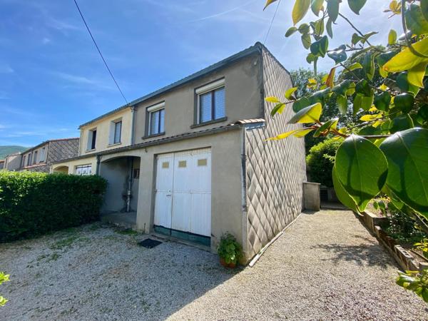 maison avec garage et jardin attenant