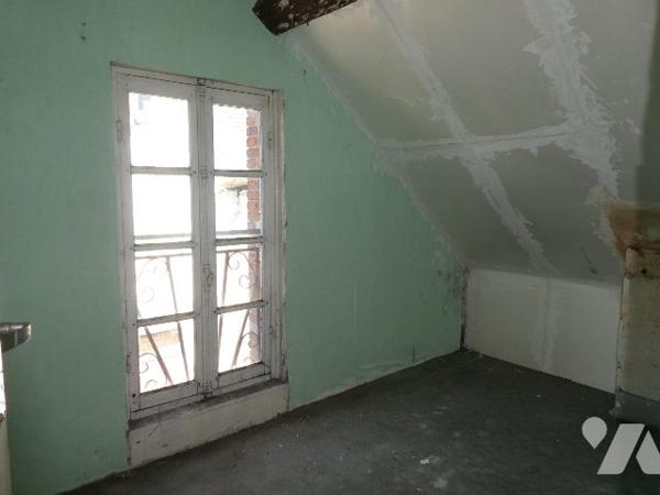 Dans bourg avec commerces et écoles