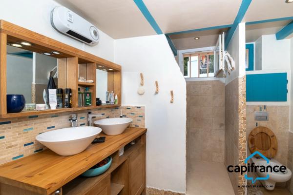 Appartement atypique de 86 m2 avec une terrasse privative de 70m2 sur les toits 4 chambres, 2 places de parking.