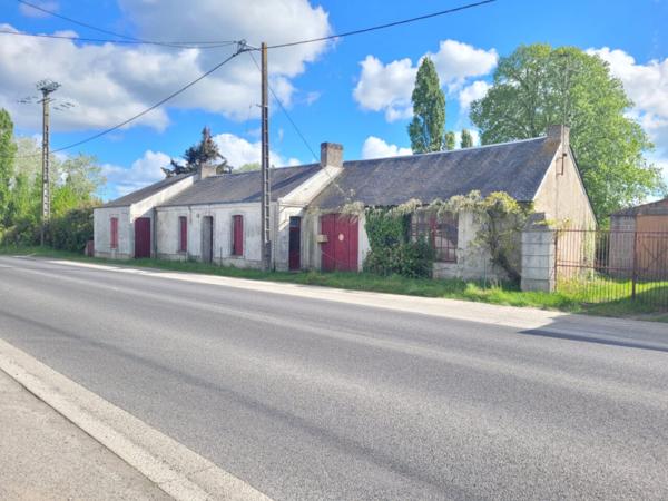 Propriété à fort potentiel avec nombreuses dépendances sur grand terrain