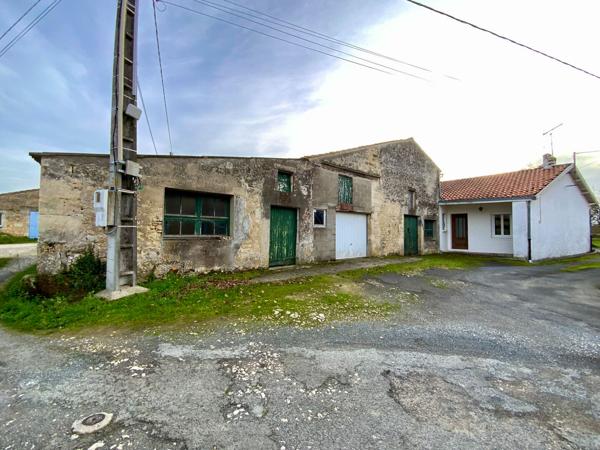 Propriété à la campagne avec dépendances et maison à rénover