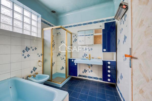 Maison familiale avec grand jardin arboré