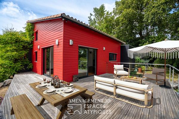 Maison en bois nichée dans un écrin au calme.