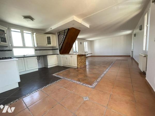 Duplex de 105 m² avec pièce de vie de 52 m²