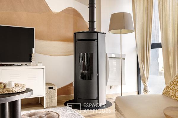 Loft et sa passerelle en verre dans une ancienne teinturerie