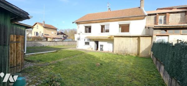 Maison centre ville avec terrain.