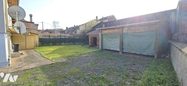 Maison centre ville avec terrain.