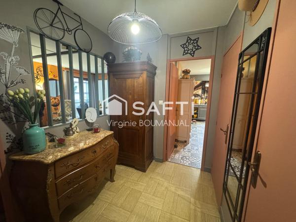 Appartement de 75 m2, 2 chambres avec garage et cave à 5 minutes du centre ville