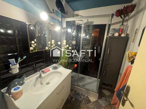 Appartement de 75 m2, 2 chambres avec garage et cave à 5 minutes du centre ville