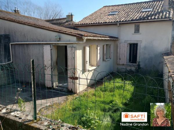 Maison avec jardin - beau potentiel à révéler !