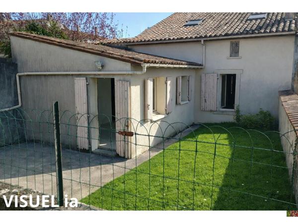 Maison avec jardin - beau potentiel à révéler !