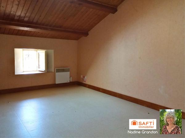 Maison avec jardin - beau potentiel à révéler !
