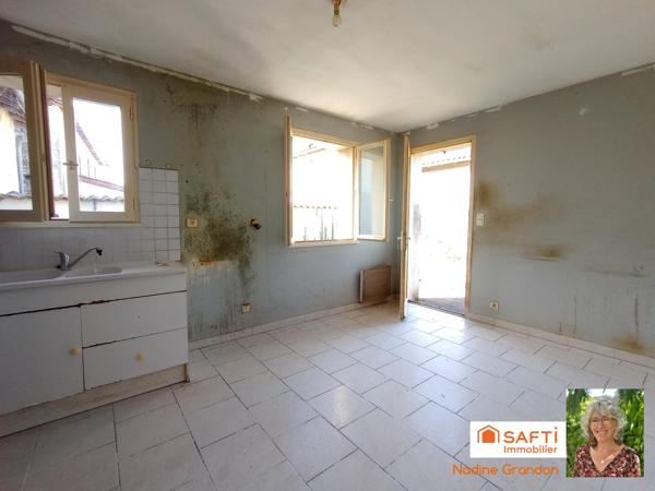 Maison avec jardin - beau potentiel à révéler !