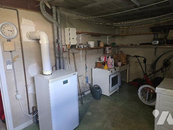 Maison de ville de 91 m² élevée sur sous-sol édifiée sur parcelle de 458 m².