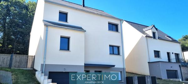 Belle maison neuve dans un cadre verdoyant