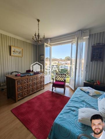 Vaste demeure de 9 pièces avec jardin clos et double balcon en plein cœur de la ville.