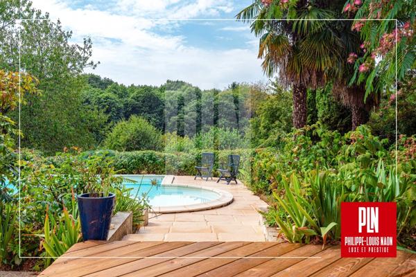 À 5MN du Mans, une propriété d'architecte rare réunissant 2 chambres de plain-pied, une piscine et un magnifique parc paysager