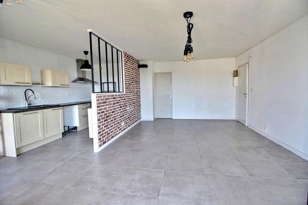 Appartement de type 3 d'environ 65m² avec balcon et place privative