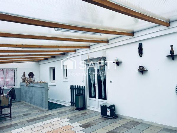 Maison familiale spacieuse avec garages à potentiel locatif – À visiter sans tarder !