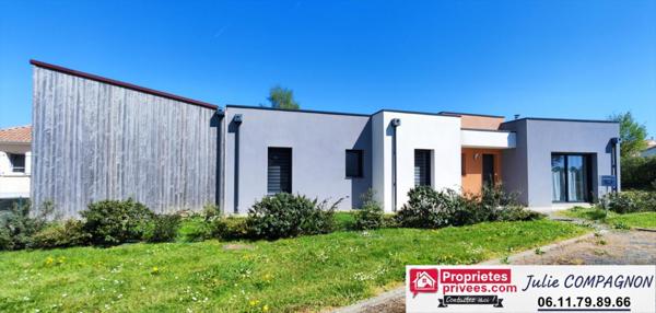 Maison 100 m² avec 2 chambres , 2 garages, grand carport et jardin