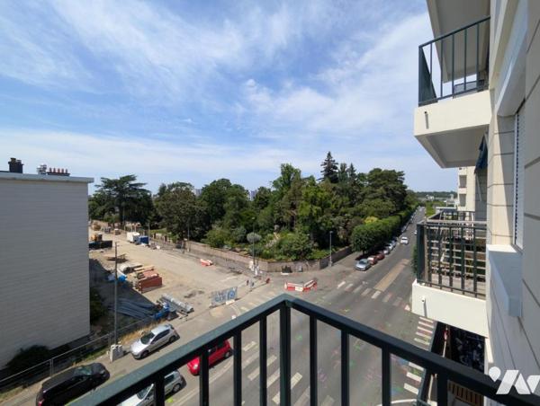 Appartement F1bis - cave et stationnement 