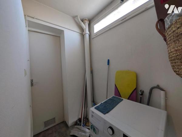 Appartement F1bis - cave et stationnement 