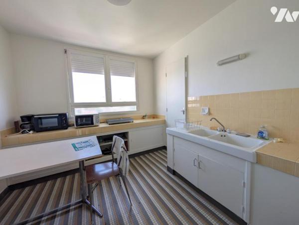 Appartement F1bis - cave et stationnement 