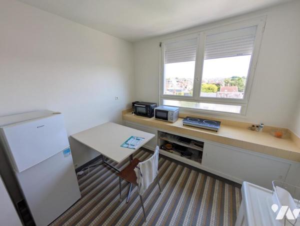 Appartement F1bis - cave et stationnement 