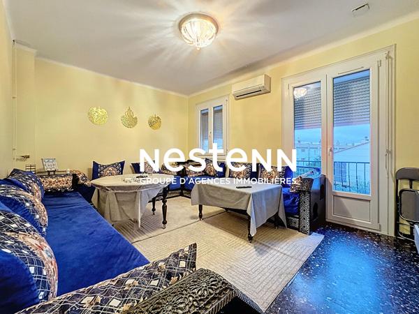 Immeuble à Perpignan de 3 appartements, 2 garages, places de parkings et jardin.