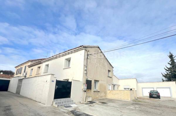 Ensemble immobilier 3 appartements: 245 m² avec jardin, terrasses et garage.