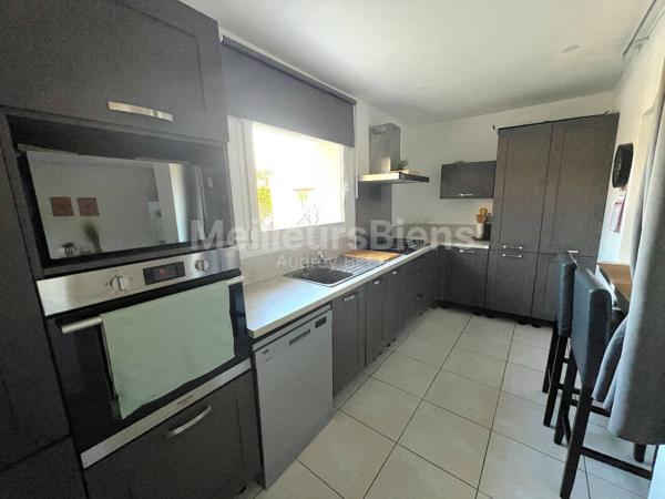 Ensemble immobilier 3 appartements: 245 m² avec jardin, terrasses et garage.
