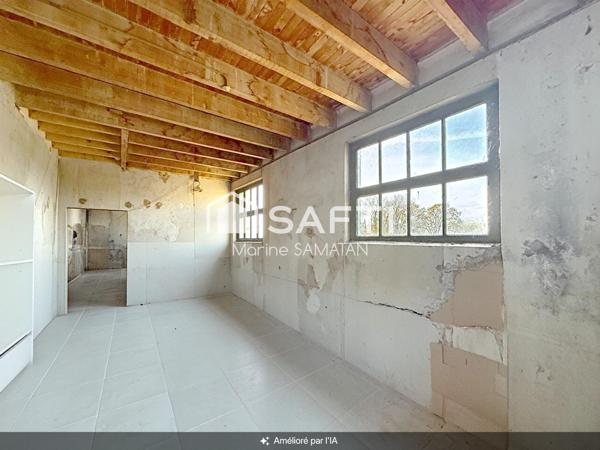Maison mitoyenne à rénover avec locaux et garage