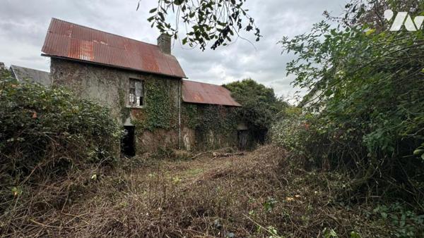 Dans le bourg de Marigny, ancienne maison d'habitation entièrement à rénover