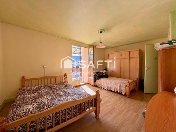 Maison de village avec garage et terrain