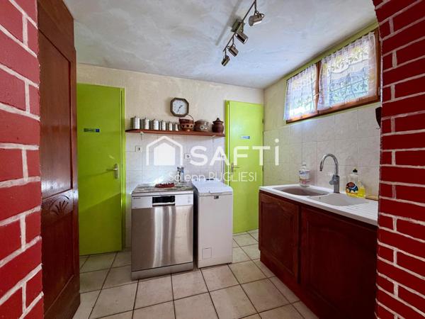 Maison de village avec garage et terrain