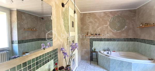 Aux pieds des Cévennes, nichée sur les hauteurs, cette superbe demeure allie harmonie charme, élégance et authenticité. Baignée de lumière, elle vous offre une vue dégagée ainsi qu'un cadre de vie privilégié, propice à la douceur de vivre. Elle est à deux pas de toutes les commodités. 247 m² sur 2 niveaux (plus combles et rez-de-jardin), cette maison vous propose de beaux volumes avec sa pièce de vie de 100 m² environ, cuisine ouverte, salon, espace détente, ouvrant sur l'extérieur, sur la piscine également (8 m x 4 m profondeur 1,5 m, avec douche et WC). La partie nuit se compose de 6 chambres, idéales pour accueillir et recevoir en toute sérénité. 1 salle d'eau avec WC au niveau 1 et 1 salle de bains avec WC séparé au niveau 2. Buanderie. Vous avez la possibilité de transformer les espaces du niveau 0 à votre guise, studio, atelier, sauna... ainsi que les combles. Pompe à chaleur, double vitrage, fibre, toiture en bon état. Le terrain en restanques de 1610 m², soigneusement aménagé vous offre de beaux espaces vous invitant à la détente dans un environnement préservé. Portail électrique, 2 garages. Propriété de caractère offrant espace, confort, au pieds de nos belles Cévennes, dans une atmosphère rare. Contactez moi, j'ai hâte de vous la faire découvrir !
At the foothills of the Cévennes, perched on elevated ground, this magnificent property combines charm, elegance, harmony, and authenticity. Bathed in natural light, it offers open views and an exceptional living environment, ideal for a peaceful lifestyle. Conveniently located just moments from all amenities, this 247 m² home is spread over two levels (plus attic space and a garden level). The house features generous living spaces, including an approximately 100 m² open-plan living area with a kitchen, lounge, and relaxation space opening directly onto the outdoors and the swimming pool (8 m x 4 m, 1.5 m deep, with an outdoor shower and WC). The sleeping area comprises six bedrooms, perfect for accommodating family and guests in complete comfort. There is one shower room with WC on the first level and one bathroom with a separate WC on the second level. A laundry room is also included. The garden-level spaces can be adapted to suit your needs and could be transformed into a studio, workshop, sauna, or other leisure areas, as can the attic space. The property benefits from a heat pump, double glazing, fibre-optic internet, and a roof in good condition. The beautifully landscaped 1,610 m² terraced plot offers attractive outdoor spaces dedicated to relaxation in a preserved natural setting. Additional features include an electric gate and two garages. A character-filled property offering space, comfort, and tranquillity at the foot of the beautiful Cévennes Mountains, in a truly unique atmosphere. Contact me today—I would be delighted to show you this exceptional home.