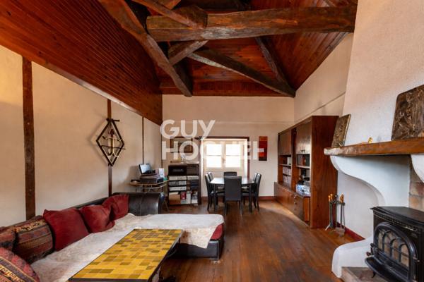 Maison de ville en pierre T4 de 121.2 m² avec jardin.