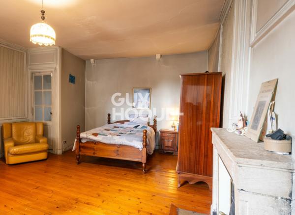 Maison de ville en pierre T4 de 121.2 m² avec jardin.
