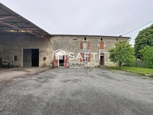 Maison en pierre avec grange attenante