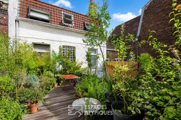 Loft avec terrasse paysagée dans une ancienne maison-boutique ouvrière