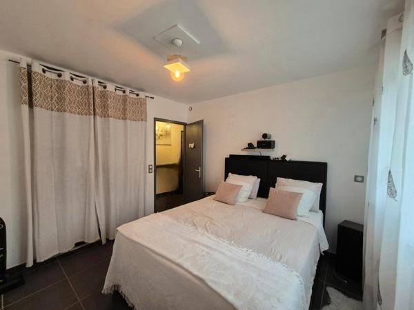 Appartement T2 de 55m2 avec jardinet et place de parking