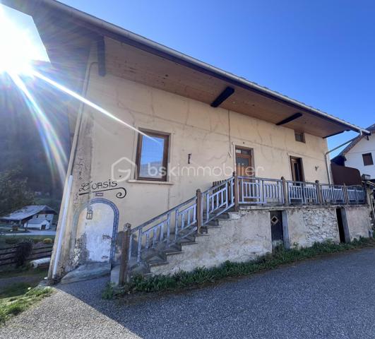Fort potentiel pour cette maison mitoyenne d'env. 60m² au coeur du village d'Argentine.
Celle ci se compose comme suit :
- au RDC : terrasse d'env. 13m², cuisine ouverte sur le salon, wc;
- à l'étage : 3 chambres, une salle d'eau avec wc;
- au dessous : garage d'env. 20m² avec la fosse septique (qui sera à remplacer - voir étude réalisée), la cave d'env. 16m² au fond, et une borne de recharge pour véhicules électriques.
Chauffage par poêle à granulés récent et radiateurs à inertie. Le toit est neuf, le tableau électrique est récent.
Travaux à réaliser : remplacement de 3 fenêtres, finition de tous les murs, rafraichissements généraux.
Mitoyen à la maison, se trouve une jolie grange, érigée sur 2 niveaux, pour env. 180m² à réhabiliter ! 
Son rez de chaussée comporte une magnifique pièce voûtée saine, qui ne demande qu'à être aménagée.
Possibilité d'agrandir la maison, ou d'en faire une seconde !
Juste à côté, se trouve également une vieille bâtisse à rénover entièrement, érigée sur 3 niveaux d'env. 17m² chacun.
Derrière, nous pouvons retrouver un terrain pentu de 387m².
A une centaine de mètres, l'ensemble possède également un terrain de 396m² non constructible mais aménageable en potager ou en jardin avec jeux par exemple.
Argentine se situe à 10 minutes de l'autoroute de Aiton, à 25 minutes d'Albertville et à 35 minutes de Chambéry. 
Les commodités et les supermarchés se trouvent à Aiguebelle à 5 minutes en voiture.