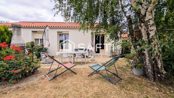 Maison chouchoutée avec garage et joli jardin