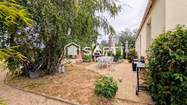Maison chouchoutée avec garage et joli jardin