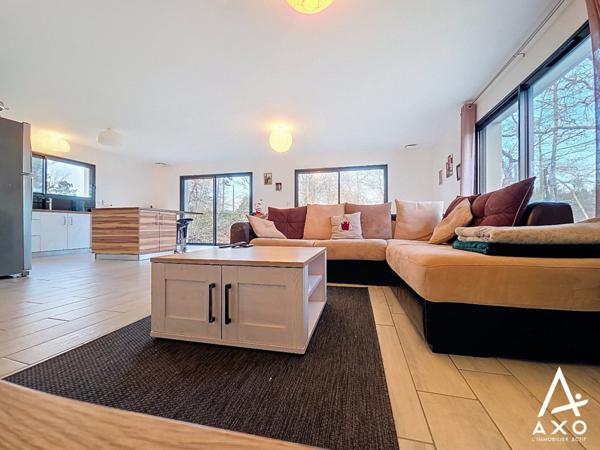 Maison contemporaine de plain pied avec garage et terrain