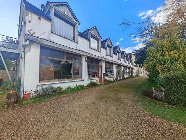 Ensemble immobilier composé de 4 appartements et 300 m² de murs commerciaux LIBRES + jardin