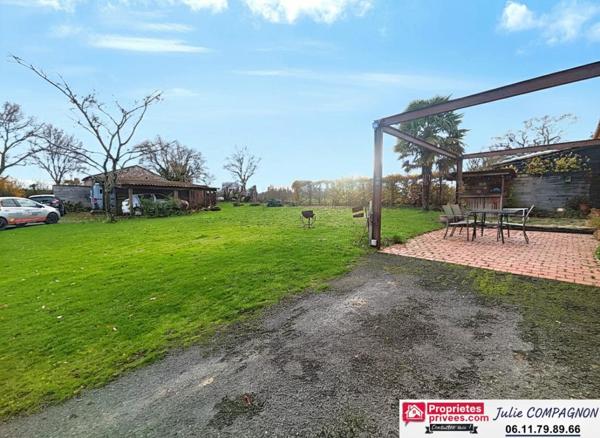 LONGERE DE CARACTERE 243 M² - 5 CHAMBRES - JARDIN - CARPORTS