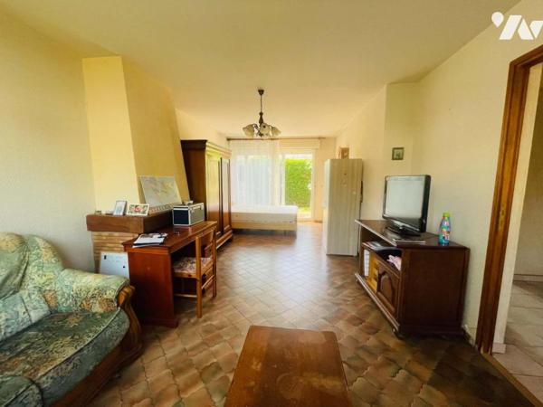 Maison 4 chambres avec garage et jardin proche des commodités 